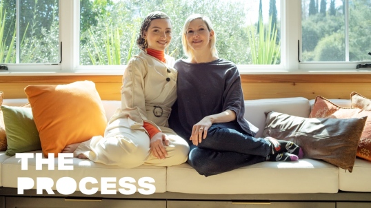 Noor Tagouri and Anna Shinoda sitting on a window seat together with the words "The Process" in the bottom corner